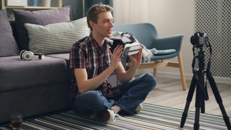 Casual setting with young adult exploring virtual reality headset technology indoors.